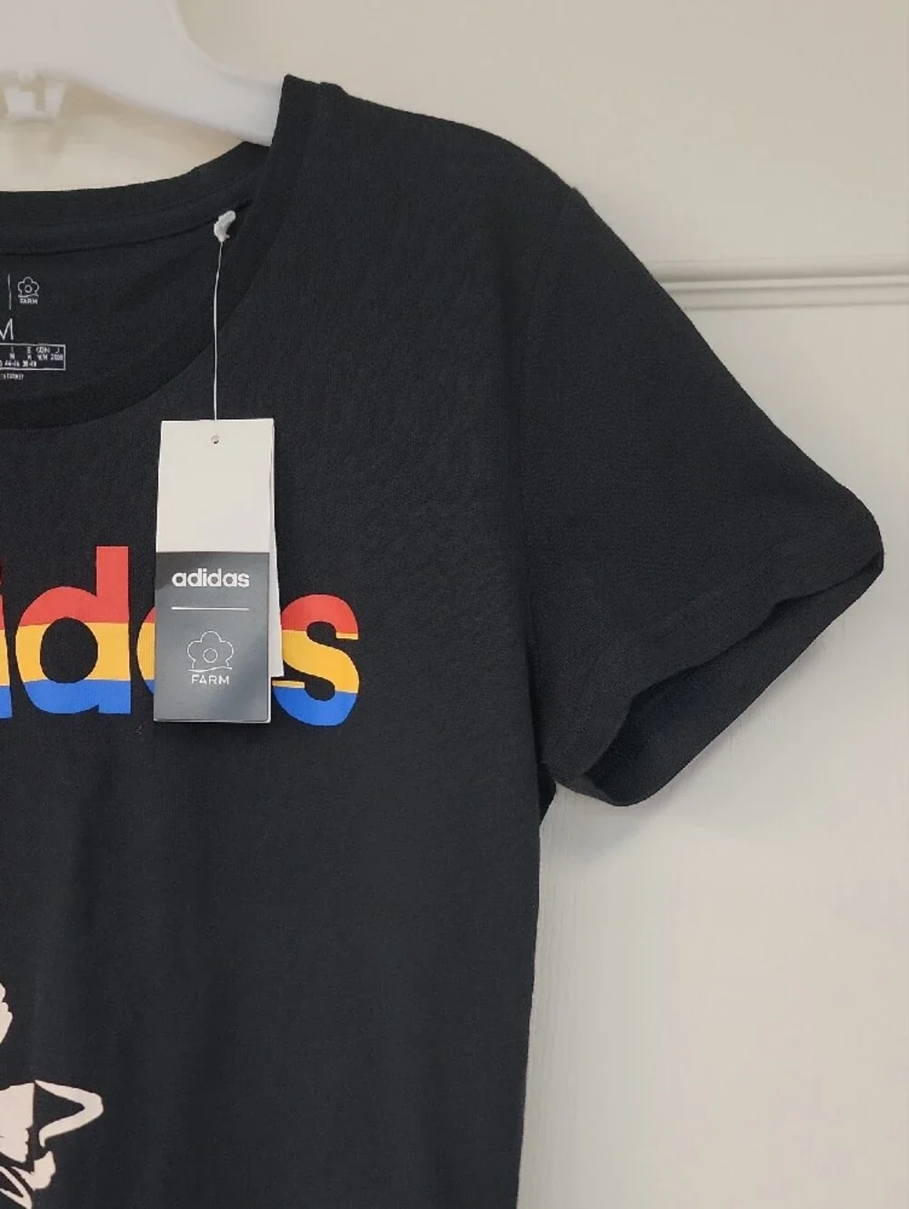 adidas Black Tee with Rainbow Logo and Yellow Butterfly Accents